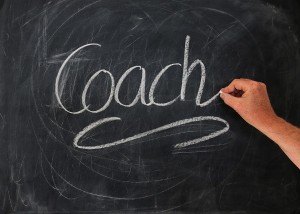 Una pizarra con la palabra coach escrita